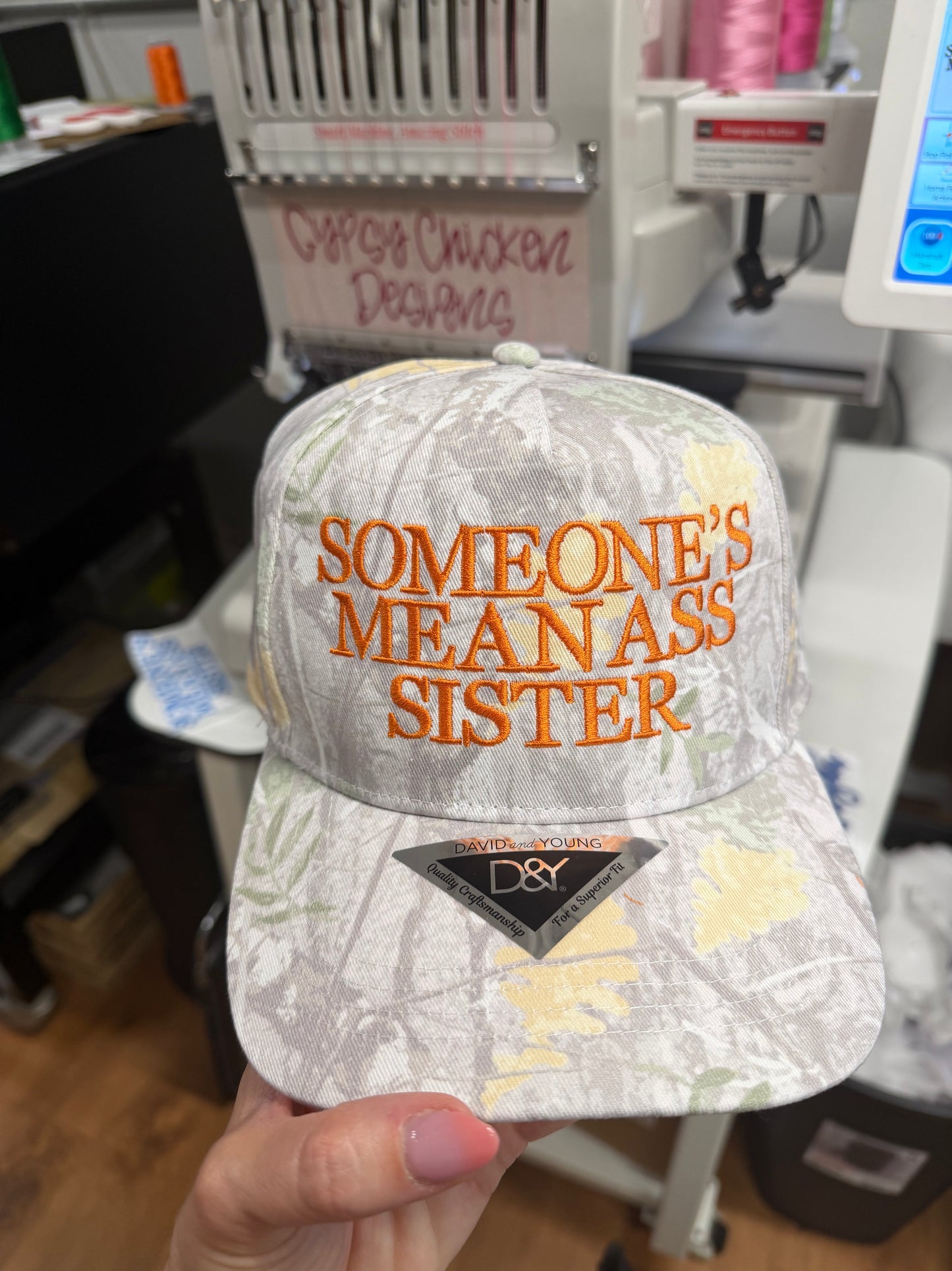 'Someone's Mean Ass Sister' embroidered camo hat.